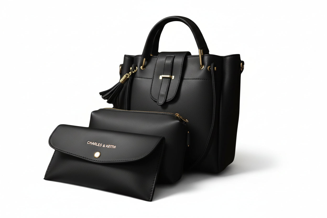 Black handbag with matching pouch on a white background